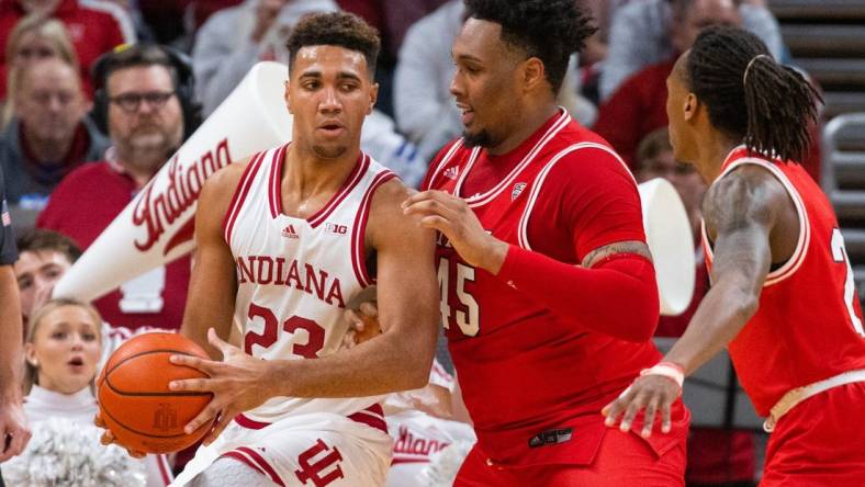 Nov 20, 2022; Indianapolis, Indiana, USA; Indiana Hoosiers forward Trayce Jackson-Davis (23) dribbles the ball while Miami (Oh) Redhawks forward Anderson Mirambeaux (45) defends in the first half at Gainbridge Fieldhouse. Mandatory Credit: Trevor Ruszkowski-USA TODAY Sports