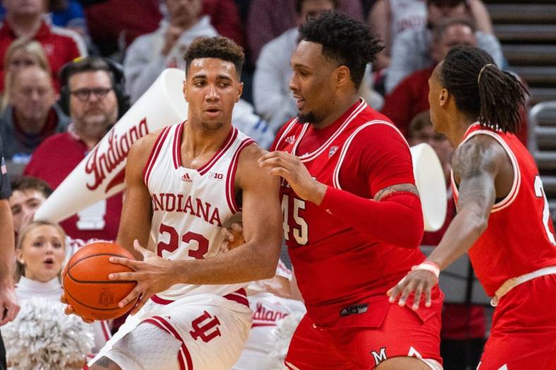 Nov 20, 2022; Indianapolis, Indiana, USA; Indiana Hoosiers forward Trayce Jackson-Davis (23) dribbles the ball while Miami (Oh) Redhawks forward Anderson Mirambeaux (45) defends in the first half at Gainbridge Fieldhouse. Mandatory Credit: Trevor Ruszkowski-USA TODAY Sports