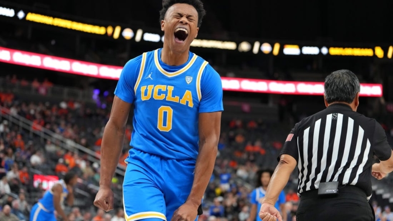 Nov 20, 2022; Las Vegas, Nevada, USA; UCLA Bruins guard Jaylen Clark (0) reacts after making a play against the Baylor Bears during the first half at T-Mobile Arena. Mandatory Credit: Stephen R. Sylvanie-USA TODAY Sports