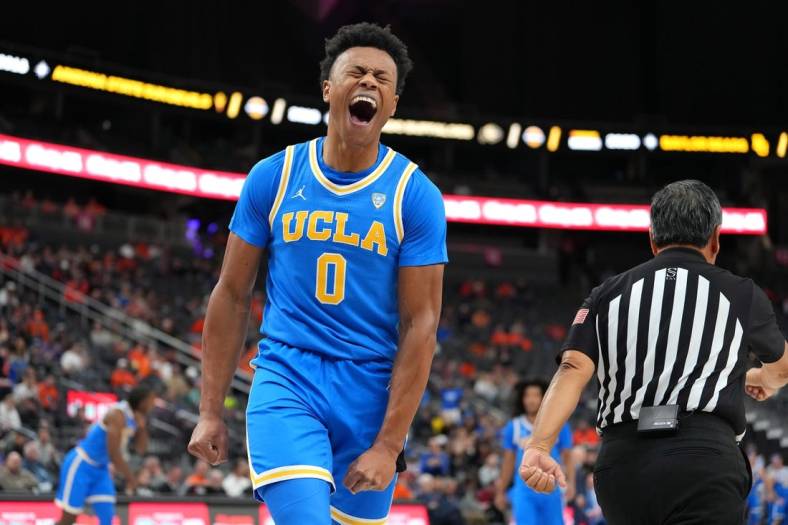 Nov 20, 2022; Las Vegas, Nevada, USA; UCLA Bruins guard Jaylen Clark (0) reacts after making a play against the Baylor Bears during the first half at T-Mobile Arena. Mandatory Credit: Stephen R. Sylvanie-USA TODAY Sports