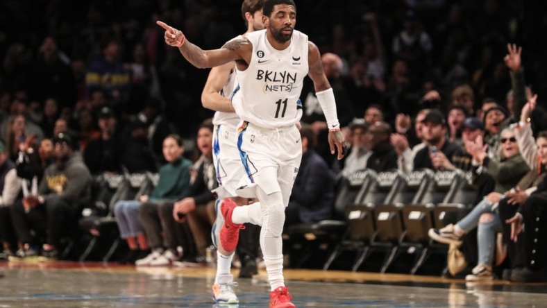 Nov 20, 2022; Brooklyn, New York, USA;  Brooklyn Nets guard Kyrie Irving (11) heads back down court after scoring in the first quarter against the Memphis Grizzlies at Barclays Center. Mandatory Credit: Wendell Cruz-USA TODAY Sports