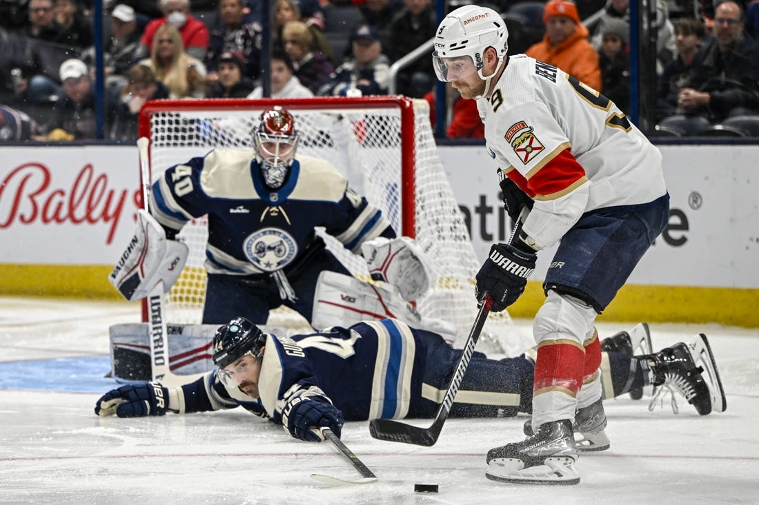 Nov 20, 2022; Columbus, Ohio, USA; Columbus Blue Jackets defenseman Erik Gudbranson (44) slides to block a shot from Florida Panthers center Sam Bennett (9) in the second period at Nationwide Arena. Mandatory Credit: Gaelen Morse-USA TODAY Sports