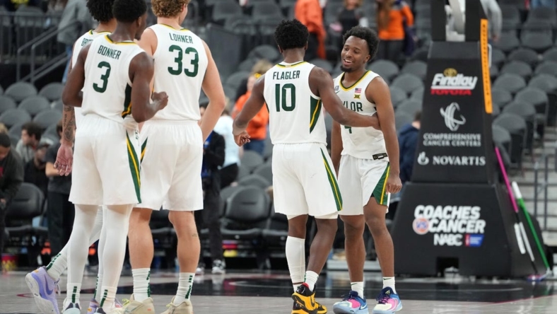 Nov 20, 2022; Las Vegas, Nevada, USA; Baylor Bears guard LJ Cryer (4) celebrates with Baylor Bears guard Adam Flagler (10) after the Bears defeated the UCLA Bruins 80-75 at T-Mobile Arena. Mandatory Credit: Stephen R. Sylvanie-USA TODAY Sports