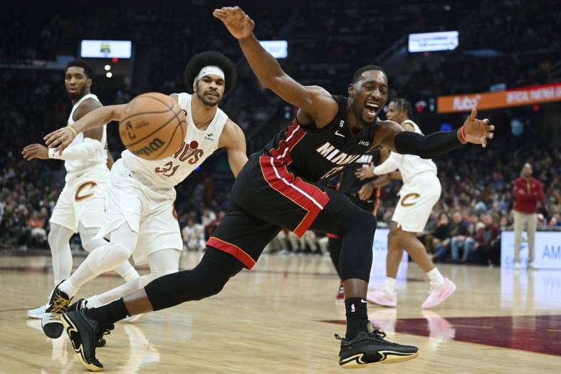 Nov 20, 2022; Cleveland, Ohio, USA; Miami Heat center Bam Adebayo (13) loses control of the ball as Cleveland Cavaliers center Jarrett Allen (31) defends during the first half at Rocket Mortgage FieldHouse. Mandatory Credit: Ken Blaze-USA TODAY Sports