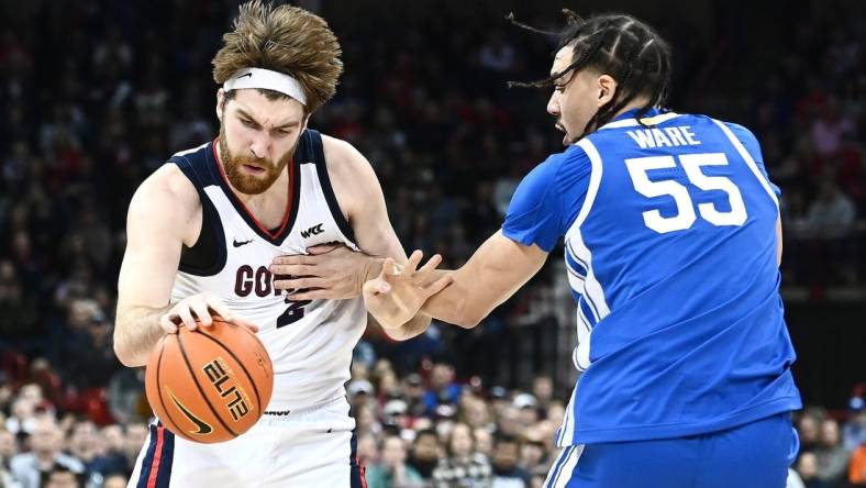 Nov 20, 2022; Spokane, Washington, USA; Gonzaga Bulldogs forward Drew Timme (2) is fouled on the drive by Kentucky Wildcats forward Lance Ware (55) in the first half at Spokane Arena. Mandatory Credit: James Snook-USA TODAY Sports