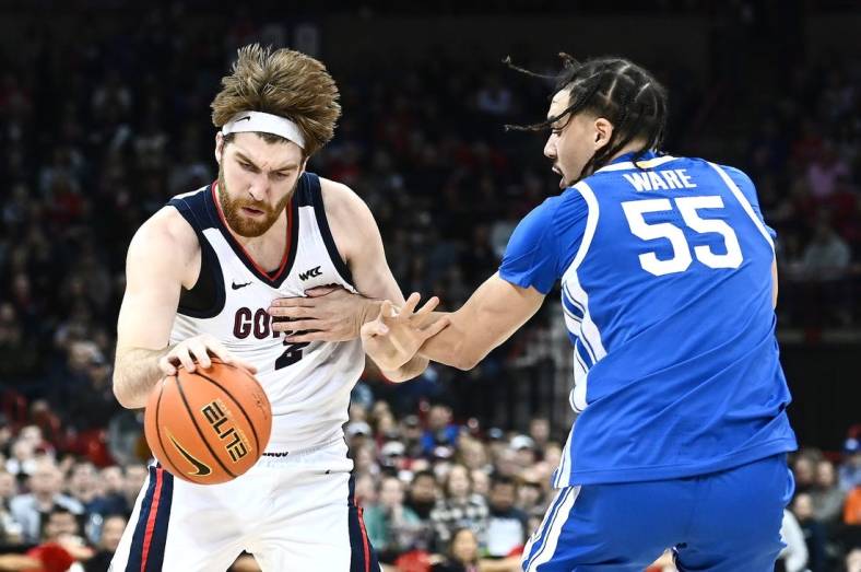 Nov 20, 2022; Spokane, Washington, USA; Gonzaga Bulldogs forward Drew Timme (2) is fouled on the drive by Kentucky Wildcats forward Lance Ware (55) in the first half at Spokane Arena. Mandatory Credit: James Snook-USA TODAY Sports