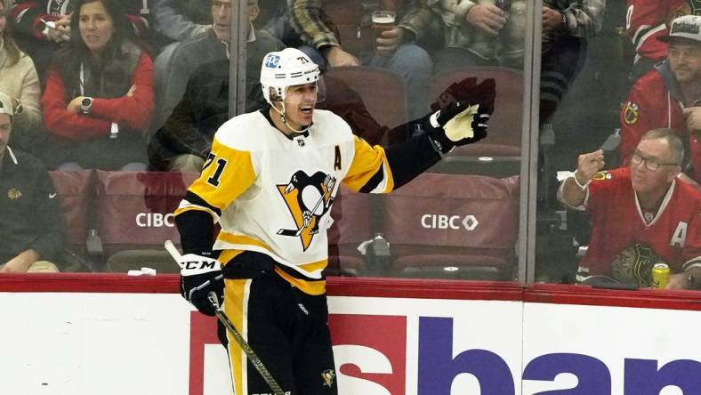 Nov 20, 2022; Chicago, Illinois, USA; Pittsburgh Penguins center Evgeni Malkin (71) celebrates his goal against the Chicago  during the second period at United Center. Mandatory Credit: David Banks-USA TODAY Sports