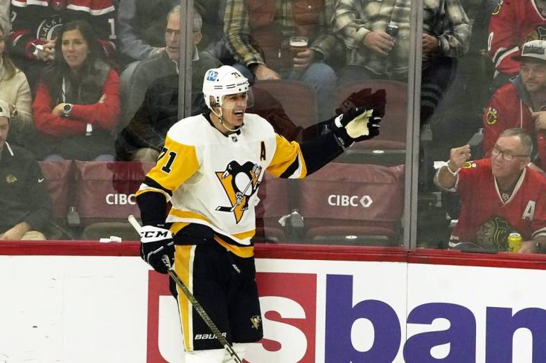 Nov 20, 2022; Chicago, Illinois, USA; Pittsburgh Penguins center Evgeni Malkin (71) celebrates his goal against the Chicago  during the second period at United Center. Mandatory Credit: David Banks-USA TODAY Sports