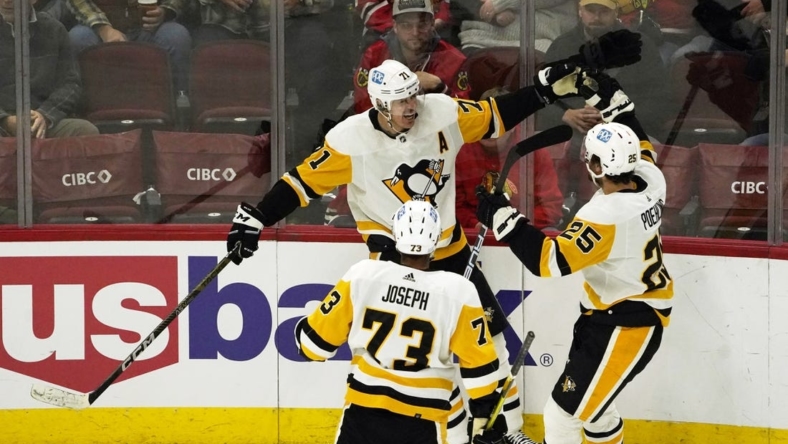 Nov 20, 2022; Chicago, Illinois, USA; Pittsburgh Penguins center Evgeni Malkin (71) celebrates his goal against the Chicago  during the second period at United Center. Mandatory Credit: David Banks-USA TODAY Sports