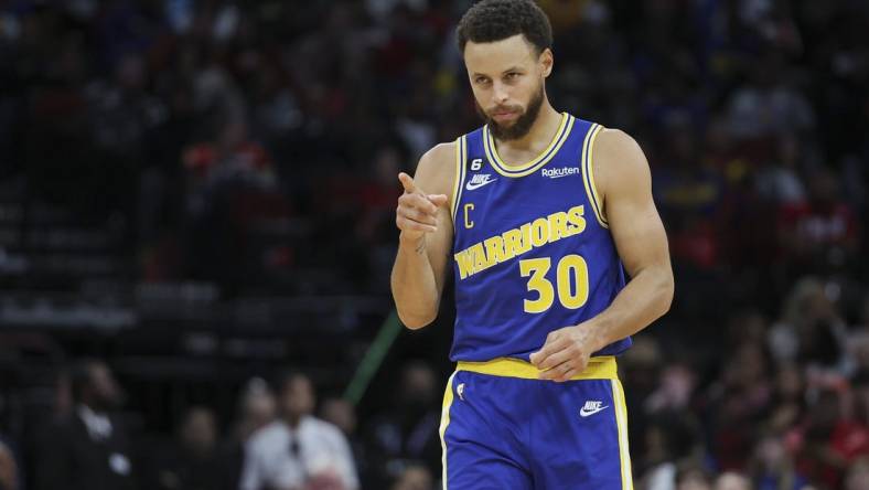 Nov 20, 2022; Houston, Texas, USA; Golden State Warriors guard Stephen Curry (30) reacts after a play during the fourth quarter against the Houston Rockets at Toyota Center. Mandatory Credit: Troy Taormina-USA TODAY Sports