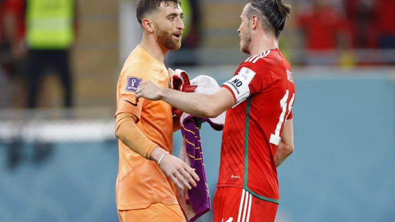 Nov 21, 2022; Al Rayyan, Qatar; United States of America goalkeeper Matt Turner (1) talks with Wales forward Gareth Bale (11) after a group stage match during the 2022 FIFA World Cup at Ahmed Bin Ali Stadium. Mandatory Credit: Yukihito Taguchi-USA TODAY Sports