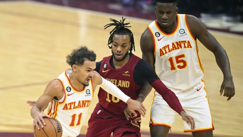 Nov 21, 2022; Cleveland, Ohio, USA; Cleveland Cavaliers guard Darius Garland (10) tries to get between Atlanta Hawks guard Trae Young (11) and center Clint Capela (15) in the first quarter at Rocket Mortgage FieldHouse. Mandatory Credit: David Richard-USA TODAY Sports