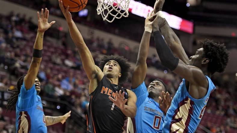 Nov 21, 2022; Tallahassee, Florida, USA; Mercer Bears guard Kamar Robertson (1) shoots the ball past Florida State Seminoles defenders during the first half at Donald L. Tucker Center. Mandatory Credit: Melina Myers-USA TODAY Sports