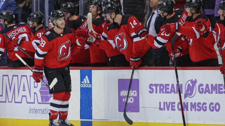 Nov 21, 2022; Newark, New Jersey, USA; New Jersey Devils defenseman Damon Severson (28) celebrates his goal with teammates during the second period against the Edmonton Oilers at Prudential Center. Mandatory Credit: Vincent Carchietta-USA TODAY Sports