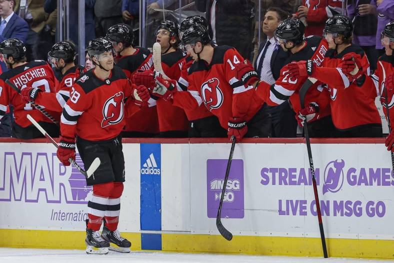 Nov 21, 2022; Newark, New Jersey, USA; New Jersey Devils defenseman Damon Severson (28) celebrates his goal with teammates during the second period against the Edmonton Oilers at Prudential Center. Mandatory Credit: Vincent Carchietta-USA TODAY Sports