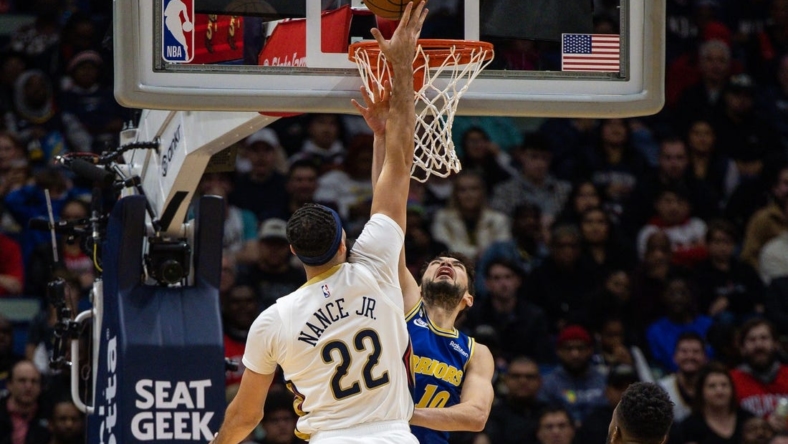 Nov 21, 2022; New Orleans, Louisiana, USA;  New Orleans Pelicans forward Larry Nance Jr. (22) dunks the ball against Golden State Warriors guard Ty Jerome (10) during the first half at Smoothie King Center. Mandatory Credit: Stephen Lew-USA TODAY Sports