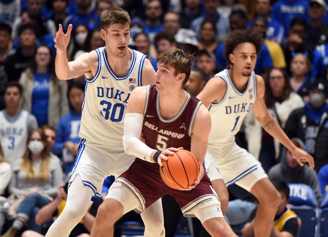 Nov 21, 2022; Durham, North Carolina, USA;  Bellarmine Knights guard Peter Suter (5) controls the ball against Duke Blue Devils center Kyle Filipowski (30) during the second half at Cameron Indoor Stadium. Mandatory Credit: Rob Kinnan-USA TODAY Sports