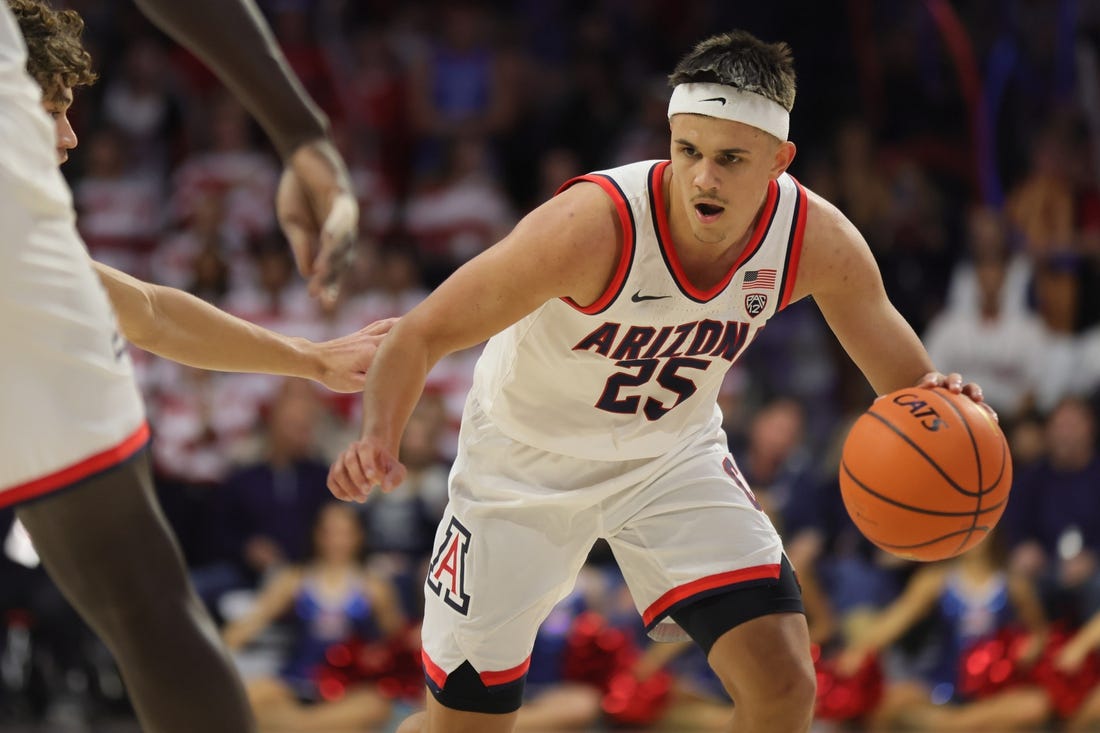 Nov 17, 2022; Tucson, Arizona, USA; Arizona Wildcats guard Kerr Kriisa (25) dribbles up the court to the basket at McKale Center. Mandatory Credit: David Cruz-USA TODAY Sports