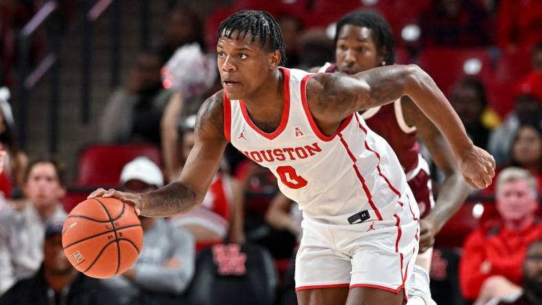 Nov 16, 2022; Houston, Texas, USA; Houston Cougars guard Marcus Sasser (0) brings the ball up court during the first half against the Texas Southern Tigers at Fertitta Center. Mandatory Credit: Maria Lysaker-USA TODAY Sports