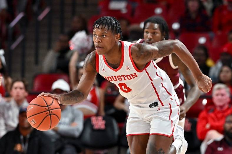 Nov 16, 2022; Houston, Texas, USA; Houston Cougars guard Marcus Sasser (0) brings the ball up court during the first half against the Texas Southern Tigers at Fertitta Center. Mandatory Credit: Maria Lysaker-USA TODAY Sports