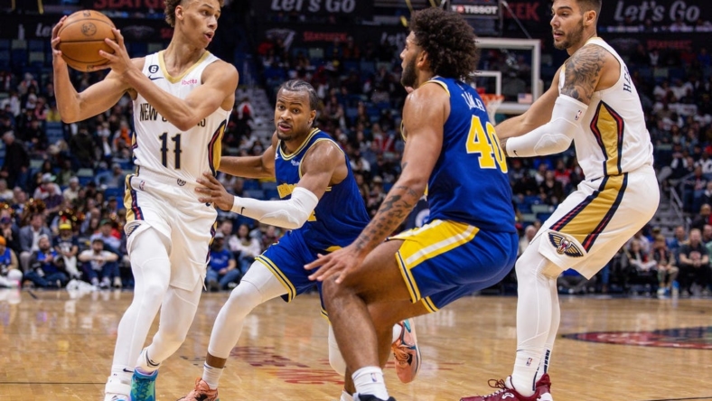 November 21, 2022;  New Orleans, Louisiana, USA;  New Orleans Pelicans guard Dyson Daniels (11) appears to pass the ball to Golden State Warriors forward Anthony Lamb (40) during the second half at Smoothie King Center.  Mandatory credit: Stephen Lew-USA TODAY Sports