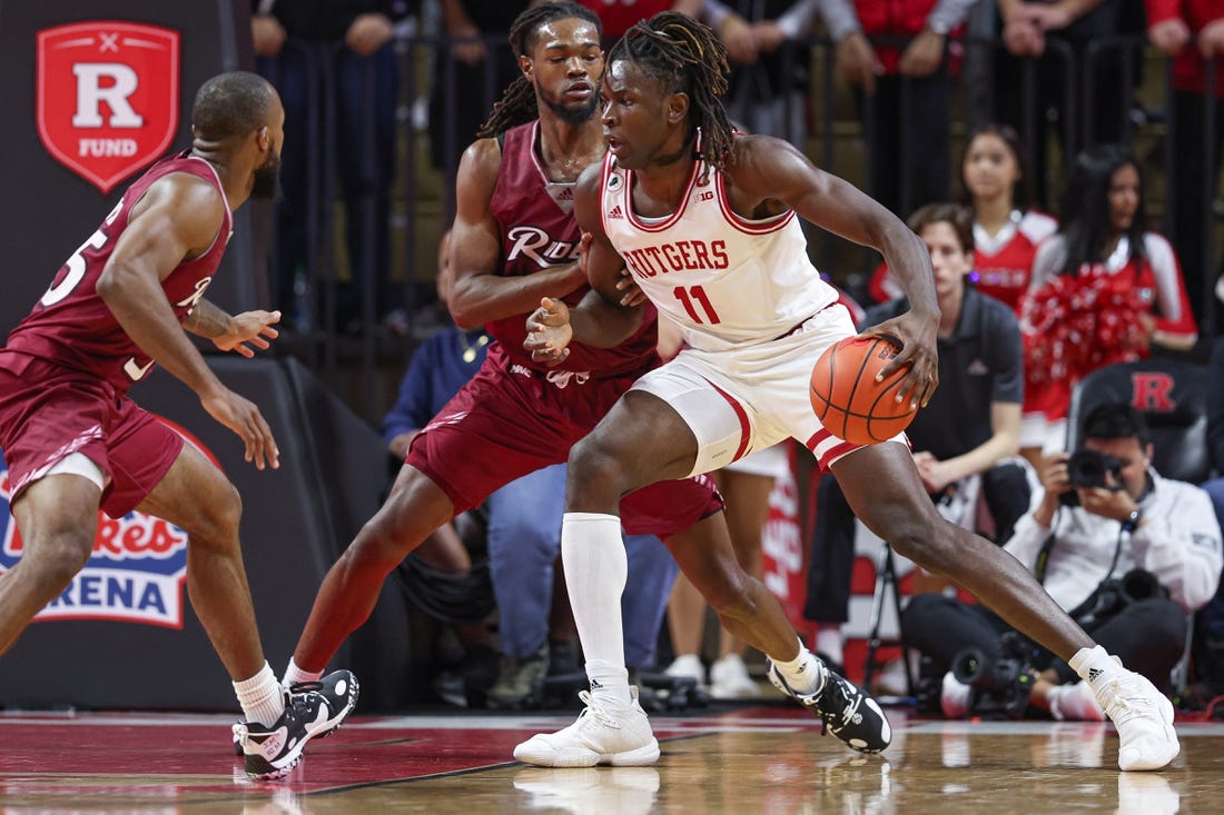 Nov 22, 2022; Piscataway, New Jersey, USA; Rutgers Scarlet Knights center Clifford Omoruyi (11) drives to the basket during the first half against Rider Broncs guard Corey McKeithan (3) at Jersey Mike's Arena. Mandatory Credit: Vincent Carchietta-USA TODAY Sports