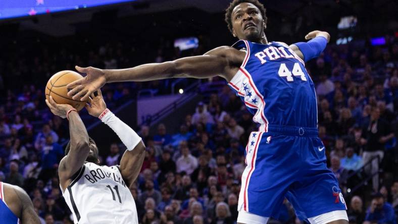 Nov 22, 2022; Philadelphia, Pennsylvania, USA; Philadelphia 76ers forward Paul Reed (44) reaches to block the shot attempt of Brooklyn Nets guard Kyrie Irving (11) during the second quarter at Wells Fargo Center. Mandatory Credit: Bill Streicher-USA TODAY Sports