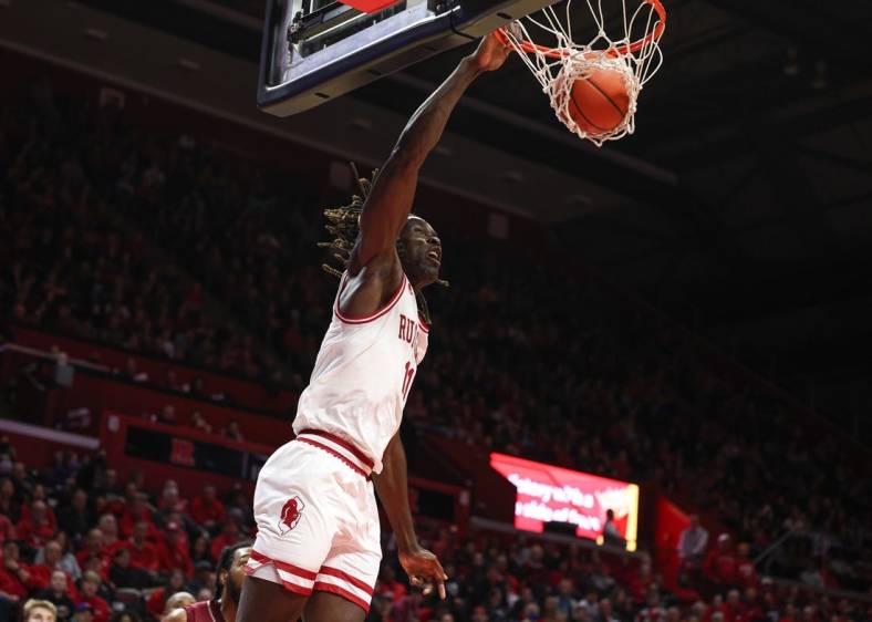 Nov 22, 2022; Piscataway, New Jersey, USA; Rutgers Scarlet Knights center Clifford Omoruyi (11) dunks the ball during the second half against the Rider Broncs at Jersey Mike's Arena. Mandatory Credit: Vincent Carchietta-USA TODAY Sports