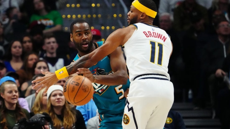 Nov 22, 2022; Denver, Colorado, USA; Detroit Pistons guard Alec Burks (5) passes the ball around Denver Nuggets forward Bruce Brown (11) in the second quarter at Ball Arena. Mandatory Credit: Ron Chenoy-USA TODAY Sports