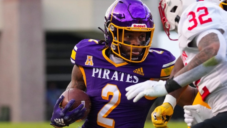 Nov 19, 2022; Greenville, North Carolina, USA;  East Carolina Pirates running back Keaton Mitchell (2) runs with the ball against the Houston Cougars during the first half at Dowdy-Ficklen Stadium. Mandatory Credit: James Guillory-USA TODAY Sports