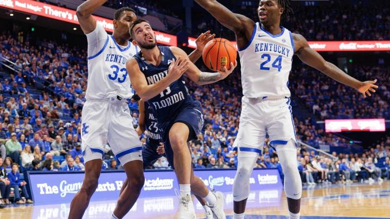 Nov 23, 2022; Lexington, Kentucky, USA; North Florida Ospreys guard Jose Placer (15) goes to the basket during the first half against the Kentucky Wildcats at Rupp Arena at Central Bank Center. Mandatory Credit: Jordan Prather-USA TODAY Sports