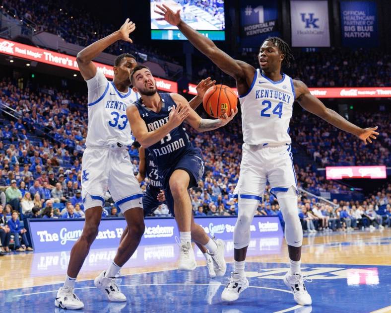 Nov 23, 2022; Lexington, Kentucky, USA; North Florida Ospreys guard Jose Placer (15) goes to the basket during the first half against the Kentucky Wildcats at Rupp Arena at Central Bank Center. Mandatory Credit: Jordan Prather-USA TODAY Sports