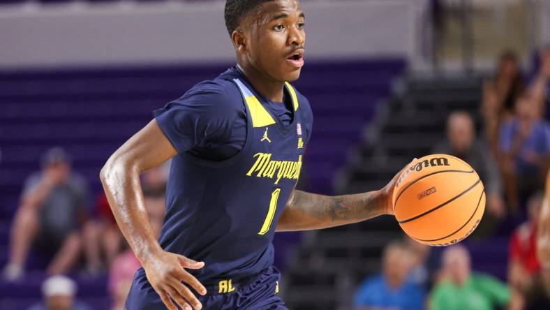 Nov 23, 2022; Fort Myers, Florida, USA;  Marquette Golden Eagles guard Kam Jones (1) controls the ball against the Georgia Tech Yellow Jackets in the first half during the Fort Myers Tip-Off Beach Division third place game at Suncoast Credit Union Arena. Mandatory Credit: Nathan Ray Seebeck-USA TODAY Sports