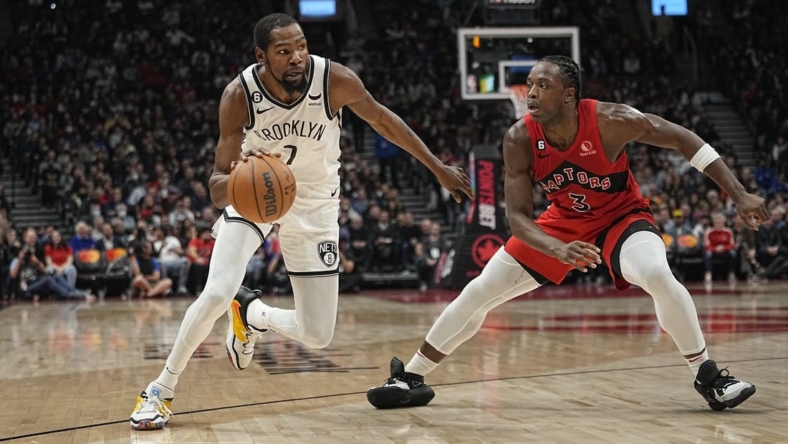 Nov 23, 2022; Toronto, Ontario, CAN; Brooklyn Nets forward Kevin Durant (7) drives to the net against Toronto Raptors forward O.G. Anunoby (3) during the second quarter at Scotiabank Arena. Mandatory Credit: John E. Sokolowski-USA TODAY Sports