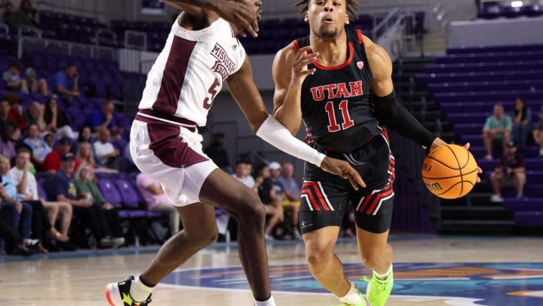 Nov 23, 2022; Fort Myers, Florida, USA;  Utah Utes guard Wilguens Exacte Jr. (11) drives to the hoop past Mississippi State Bulldogs forward Kimani Hamilton (5) in the first half during the Fort Myers Tip-Off Beach Division championship game at Suncoast Credit Union Arena. Mandatory Credit: Nathan Ray Seebeck-USA TODAY Sports