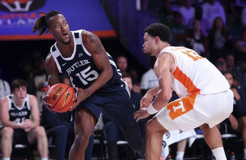 Nov 23, 2022; Paradise Island, BAHAMAS; Butler Bulldogs center Manny Bates (15) looks to pass as Tennessee Volunteers forward Olivier Nkamhoua (13) defends during the second half at Imperial Arena. Mandatory Credit: Kevin Jairaj-USA TODAY Sports