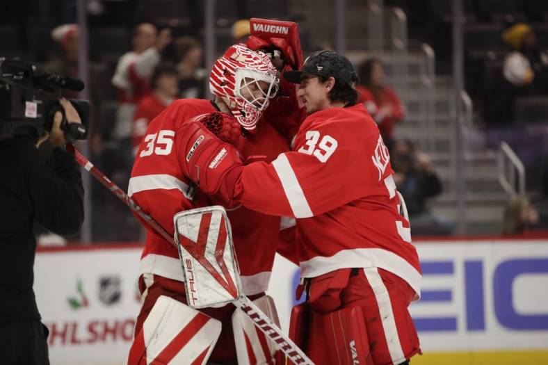 Nov 23, 2022; Detroit, Michigan, USA; Detroit Red Wings goalie Alex  Nedeljkovic (39) congratulates goalie Ville  Husso  (35) on his shut out at the end of the game at Little Caesars Arena. Mandatory Credit: Brian Sevald-USA TODAY Sports