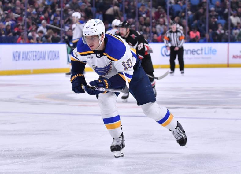 Nov 23, 2022; Buffalo, New York, USA; St. Louis Blues center Brayden Schenn (10) chases the puck in the third period against the Buffalo Sabres at KeyBank Center. Mandatory Credit: Mark Konezny-USA TODAY Sports