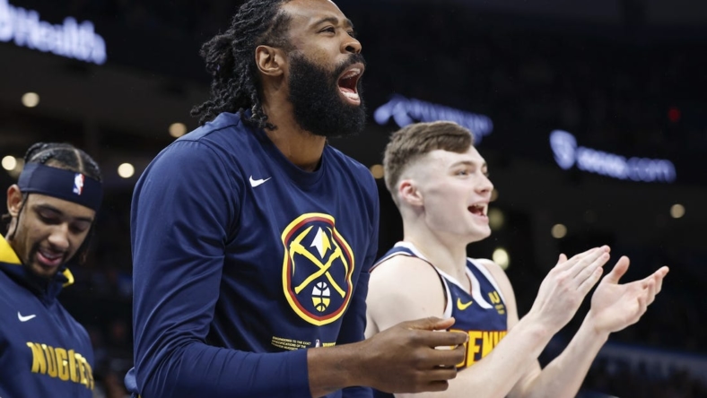 Nov 23, 2022; Oklahoma City, Oklahoma, USA; Denver Nuggets center DeAndre Jordan (6) and guard Christian Braun (0) watch their team play against the Oklahoma City Thunder during the second half at Paycom Center. Denver won 131-126 during overtime. Mandatory Credit: Alonzo Adams-USA TODAY Sports