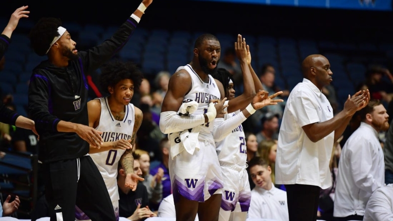 Nov 23, 2022; Anaheim, California, USA; Washington Huskies center Franck Kepnang (11) and the bench react against the Fresno State Bulldogs during the second half at Anaheim Convention Center. Mandatory Credit: Gary A. Vasquez-USA TODAY Sports