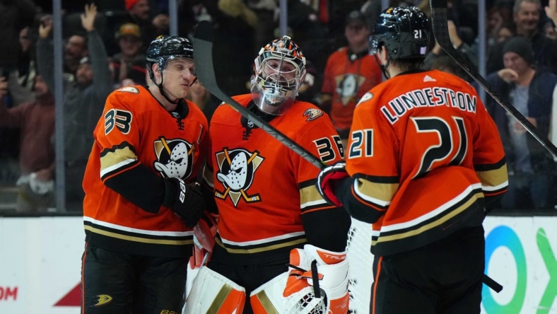 Nov 23, 2022; Anaheim, California, USA; Anaheim Ducks right wing Jakob Silfverberg (33), goaltender John Gibson (36) and center Isac Lundestrom (21) celebrate after the game against the New York Rangers at Honda Center. Mandatory Credit: Kirby Lee-USA TODAY Sports