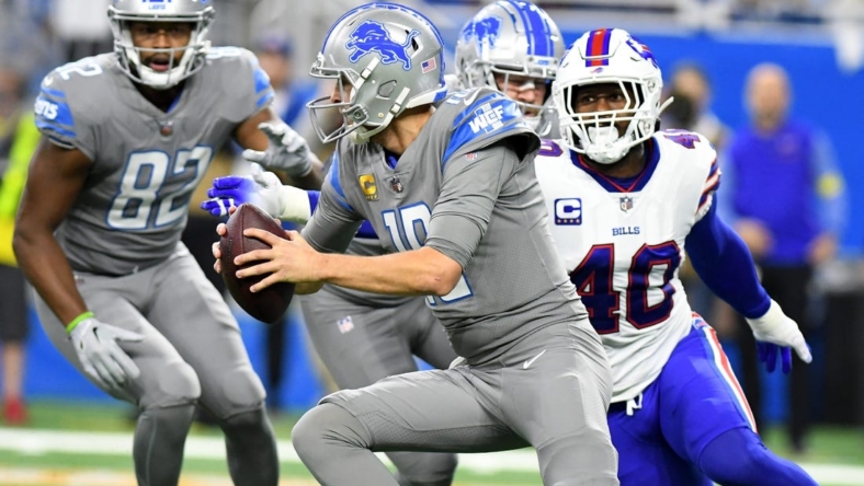 Nov 24, 2022; Detroit, Michigan, USA; Detroit Lions quarterback Jared Goff (16) scrambles away from Buffalo Bills linebacker Von Miller (40) in the first quarter at Ford Field. Mandatory Credit: Lon Horwedel-USA TODAY Sports