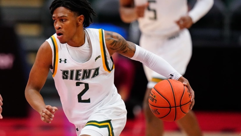 Nov 24, 2022; Orlando, FL, USA; Siena Saints guard Javian McCollum (2) drives towards the basket against the Florida State Seminoles during the second half at ESPN Wide World of Sports. Mandatory Credit: Rich Storry-USA TODAY Sports