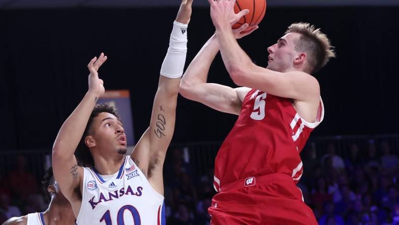 Nov 24, 2022; Paradise Island, BAHAMAS; Wisconsin Badgers forward Tyler Wahl (5) shoots over Kansas Jayhawks forward Jalen Wilson (10) during the second half at Imperial Arena. Mandatory Credit: Kevin Jairaj-USA TODAY Sports