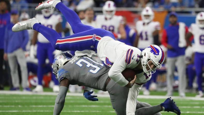 Detroit Lions safety Kerby Joseph (31) tackles Buffalo Bills quarterback Josh Allen (17) during first-half action at Ford Field on Thursday, Nov. 24, 2022.

Lions 112422 Kd 3281