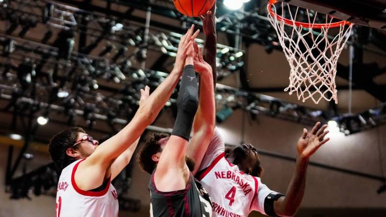 Nov 24, 2022; Orlando, Florida, USA; Nebraska Cornhuskers forward Juwan Gary (4) blocks Oklahoma Sooners forward Tanner Groves (35) shot during the second half at State Farm Field House. Mandatory Credit: Rich Storry-USA TODAY Sports