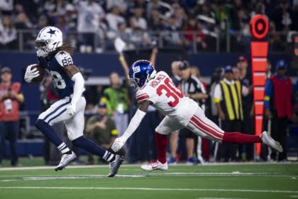 Nov 24, 2022; Arlington, Texas, USA; Dallas Cowboys wide receiver CeeDee Lamb (88) catches a pass for a first down as New York Giants cornerback Darnay Holmes (30) defends during the second half of the game between the Cowboys and the Giants at AT&T Stadium. Mandatory Credit: Jerome Miron-USA TODAY Sports