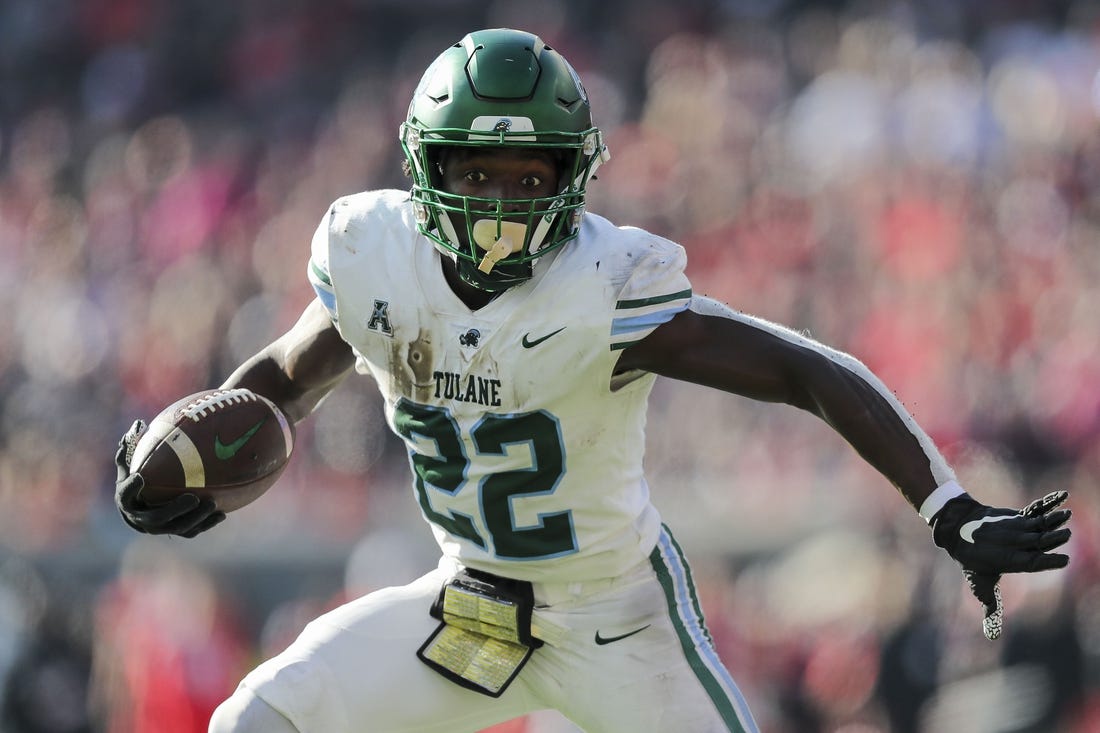 Nov 25, 2022; Cincinnati, Ohio, USA; Tulane Green Wave running back Tyjae Spears (22) runs for a touchdown against the Cincinnati Bearcats in the first half at Nippert Stadium. Mandatory Credit: Katie Stratman-USA TODAY Sports