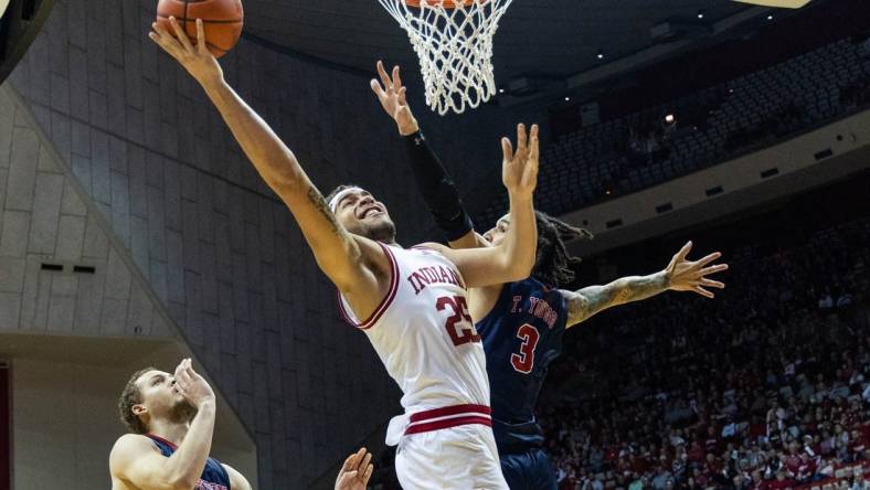 Nov 25, 2022; Bloomington, Indiana, USA; Indiana Hoosiers forward Race Thompson (25) shoots the ball while Jackson State Tigers forward Trace Young (3) defends in the first half at Simon Skjodt Assembly Hall. Mandatory Credit: Trevor Ruszkowski-USA TODAY Sports