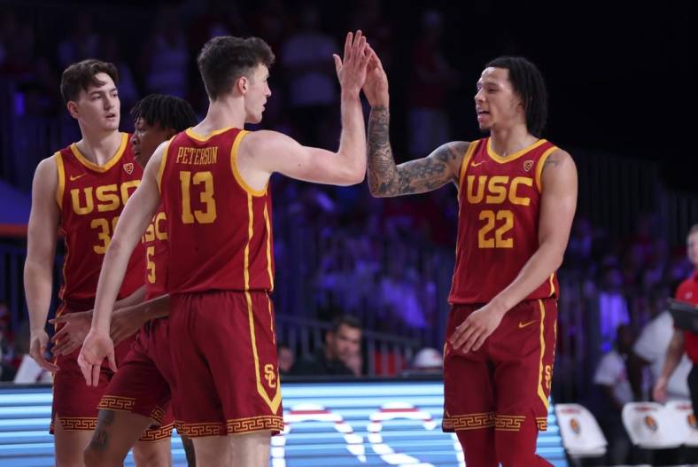 Nov 25, 2022; Paradise Island, BAHAMAS; USC Trojans guard Tre White (22) celebrates with USC Trojans guard Drew Peterson (13) during the first half against the Wisconsin Badgers  at Imperial Arena. Mandatory Credit: Kevin Jairaj-USA TODAY Sports